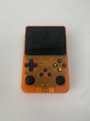 switch oled: Портативная ретро‑приставка Game Console R36S (оранжевый прозрачный — 1