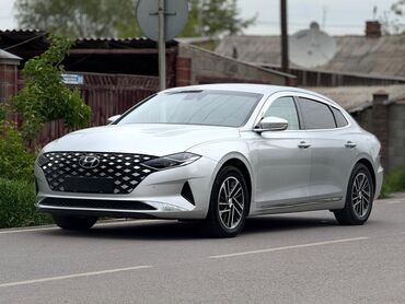 Hyundai: Hyundai Grandeur серебристого цвета. Этот седан отличается элегантным