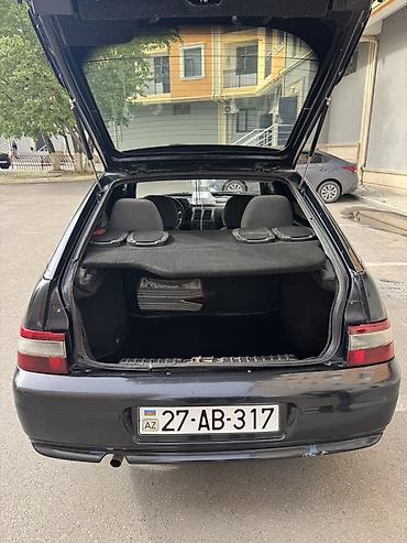 VAZ (LADA): Model: Lada 2112 (hatchback, 5 qapı) Rəng: qara (mat) Yanacaq: benzin — 8