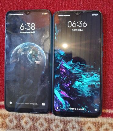 зарядные устройства для телефонов tronsmart: Два смартфона Redmi 9A, один в бирюзовом цвете, другой в черном
