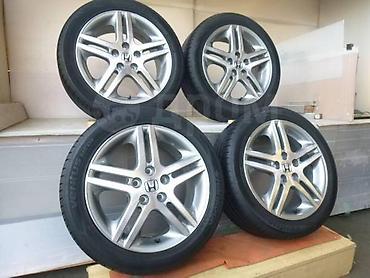 Колеса в сборе: Комплект из 4 легкосплавных дисков Honda с шинами. Характеристики: - — 1
