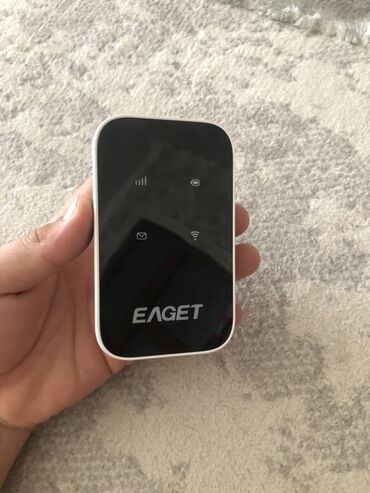 интернет сайма: Портативный Wi-Fi роутер Eaget в белом корпусе. Компактное устройство