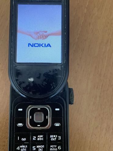 nokia knopkali: Nokia 7373 Ishleyir,original adapteri, naushniki teze qalib. Ustunde