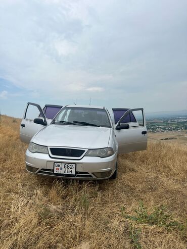 кемин авто: Автомобиль Daewoo Nexia серебристого цвета. Установлены тонированные