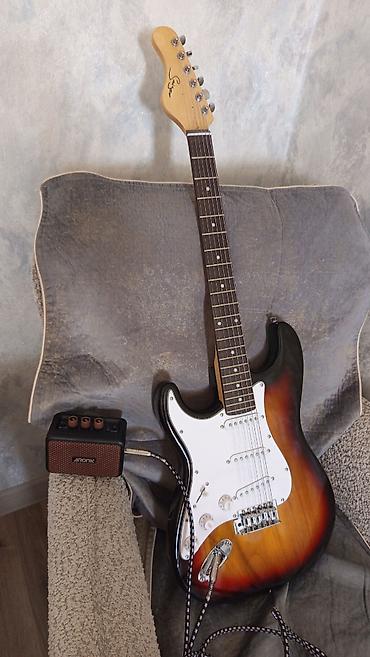 elektro gitarlar: Smiger elektro gitarla amfi (səsucaldıcı) satıram, 2 aydı almışam, 4-5 — 1