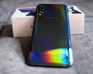 Техника и электроника: Samsung Galaxy A50, 128 ГБ, цвет - Черный, Две SIM карты, Отпечаток пальца, Face ID — 1