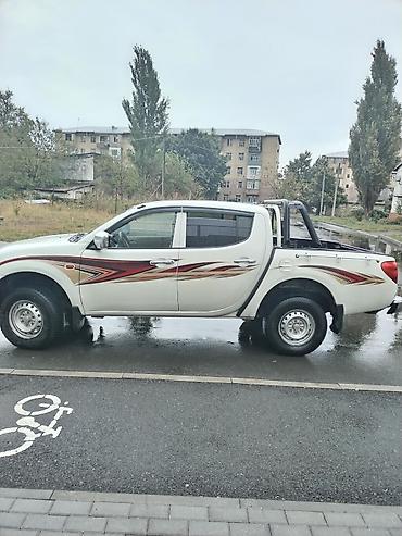 235 55 18: Mitsubishi L200: 2.4 l | 2008 il 302118 km Pikap — 4