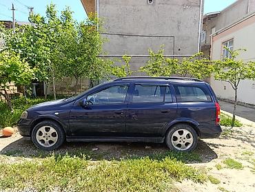 opel astra 2015: Opel Astra Caravan (universał) – tünd mavi rəng, 5 qapı, geniş baqajlı — 2