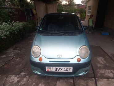 мини электромобиль: Автомобиль Daewoo Matiz, представленный в мятно-зеленом цвете