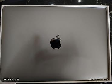 ucuz macbook pro: Apple noutbuk – Space Gray rəngdə, metal korpus. Qapaqda Apple loqosu — 1
