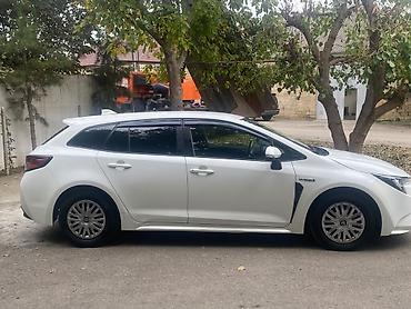 toyota bakı: Toyota Corolla Touring Sports Hybrid – ağ rəngli universal kuzov — 4