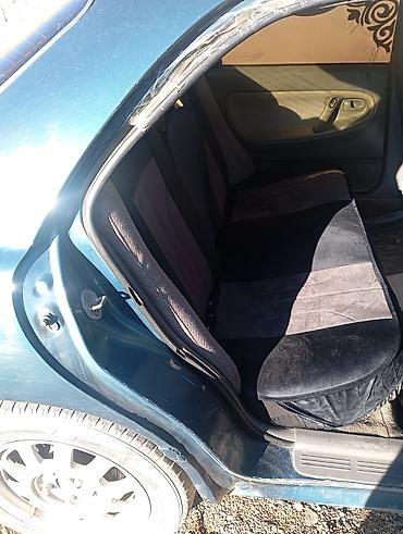 kia spektra: Mazda 323: 1993 г., Седан — 5