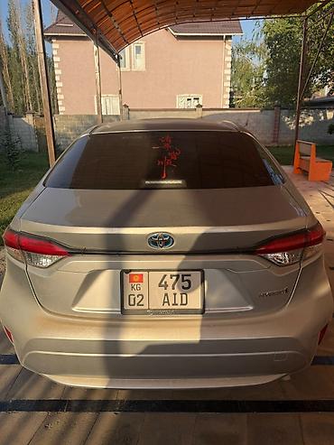 s 221: Toyota Corolla: 2022 г., 1.8 л, Автомат, Гибрид, Седан — 2