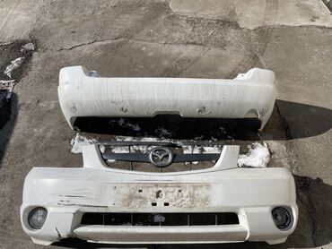 chyngyz: Передний Бампер Mazda 2001 г., Б/у, цвет - Белый, Оригинал