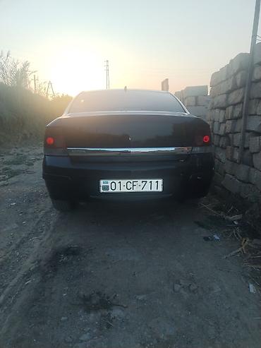Opel: Opel Astra sedan - Kuzov: 4 qapılı sedan, qara rəng - Salon: parça — 1