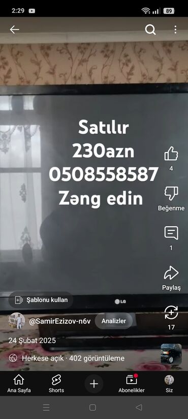 et çeken maşın: LG brendinə məxsus televizor. Cihaz tünd rəngdə korpusa malikdir və