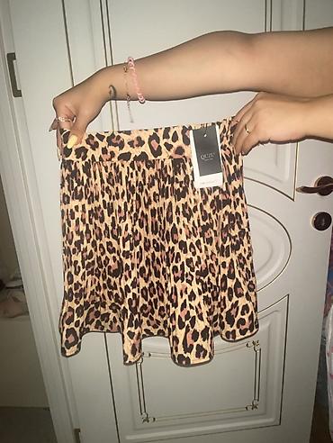 ağ ətəklər: Brend: QUZU S M razmer Model: qısa ətək Naqış: leopard printi — 2
