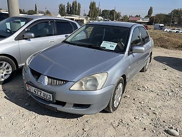 сузуки лиано: Mitsubishi Lancer: 2004 г., Автомат, Бензин, Седан — 1