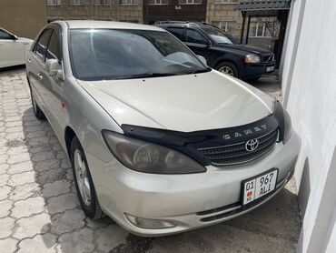 скутеры новый: Автомобиль Toyota Camry, представленный в кузове седан, отличается