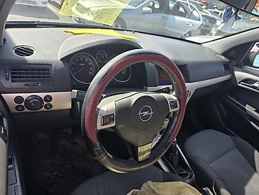 Панели, обшивки: Opel Astra H, хэтчбек/седан (интерьер) - Руль с мультимедийными — 1