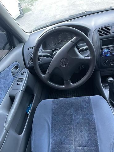 машинка б у: Mazda 323: 1999 г., 1.6 л, Механика, Бензин, Седан — 2