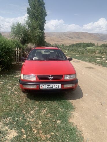 раф 4 2009: Автомобиль Volkswagen Passat в кузове универсал, красного цвета