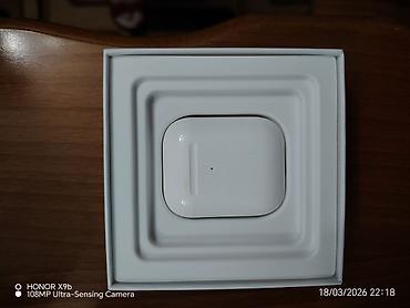 ipad qiymetleri: Təzədir. Zaryatqani ela saxliyir. Apple AirPods (simli/Lightning şarj — 2