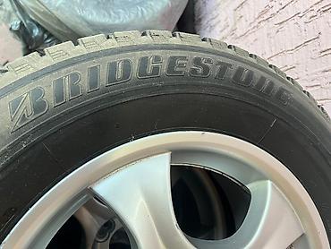 шины 235 70 16: Комплект шин Bridgestone на дисках - Бренд шин: Bridgestone - Тип — 2