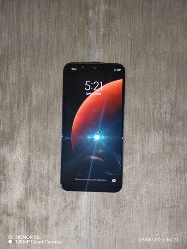 дисплеи для телефонов: Смартфон Xiaomi с синим корпусом и полноэкранным дисплеем. Устройство
