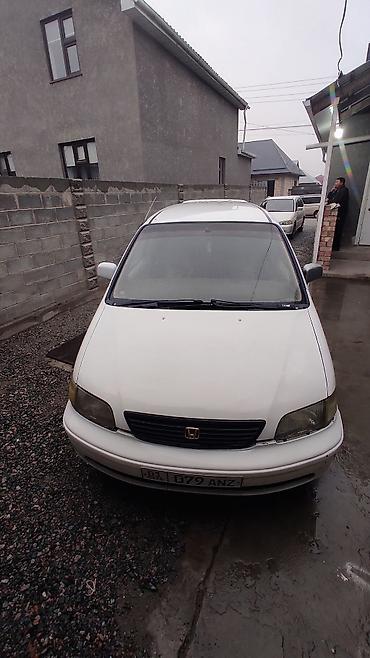 Другие детали салона: Honda (правый руль), салон минивэна. Описание: - Просторный 2‑рядный — 7