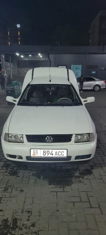 электромобиль neta: Белый фургон Volkswagen Caddy – это компактный и универсальный