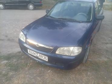 губа 211: Mazda 323: 2000 г., Механика, Бензин — 4