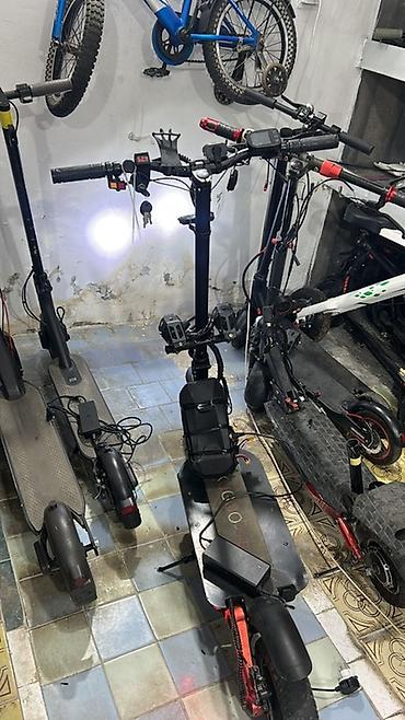 электросамокат бу: Elektrikli skuter. Şəkillərdə qara rəngli, iri təkərli elektrikli — 10
