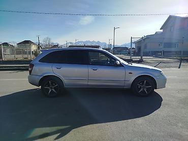 слиндир: Mazda Familia: 2002 г., Механика, Бензин, Хэтчбэк — 10