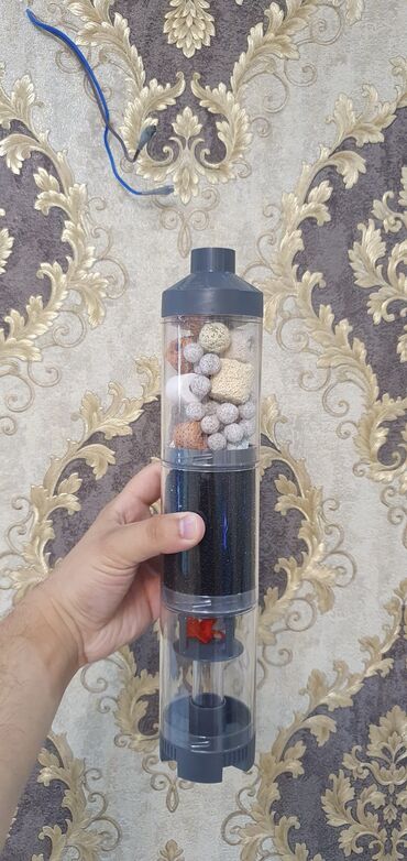 Akvarium aksessuar və ləvazimatları: Ağ rəngli silindrik korpusa malik akvarium xarici filtri. Qablaşdırma — 9