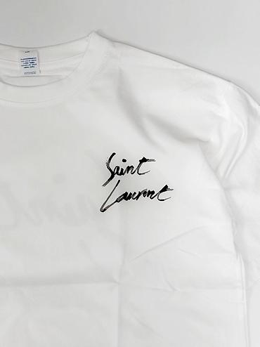 Futbolkalar: Ağ rəngli qısaqoll T‑shirt - Ön hissədə sinə sol tərəfdə “Saint — 2