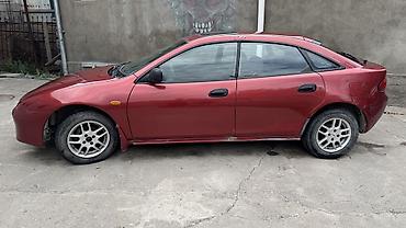 Транспорт: Mazda Lantis: 1997 г., 1.6 л, Механика, Бензин, Хэтчбэк — 1