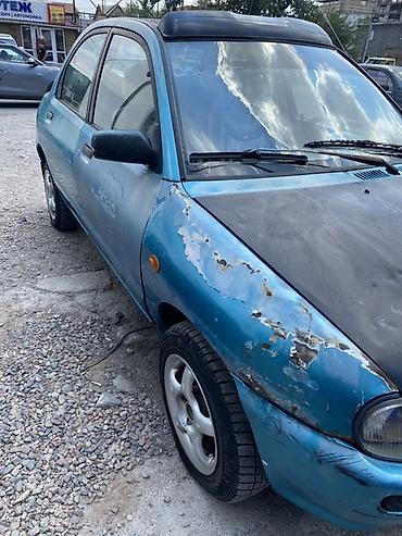 фара мазда 121: Mazda 121: 1991 г., Седан — 3