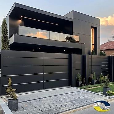 Фасадные работы: Современный двухэтажный дом с плоской крышей и панорамными окнами. - — 10