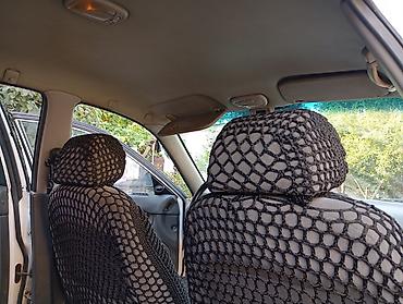 Daewoo: Daewoo Nubira sedan - Kuzov: 4 qapılı sedan, ağ rəng - Ban dizaynı — 12