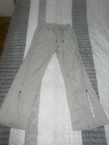 vikend torba: Nike Sportswear Collection Women's Mid-Rise Repel Zip Trousers vel. XS — 7