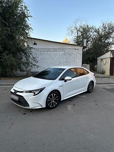 voxy noah: Toyota Corolla: 2023 г., 1.8 л, Вариатор, Гибрид, Седан — 1