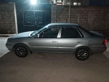 Toyota: Toyota Corolla: 1.6 л | 1999 г. Седан — 6