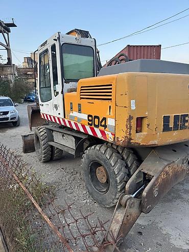 ekskavatör: Liebherr 904 təkərli ekskavator.İl 2000, işləmə saatı 27000, çox əla — 2
