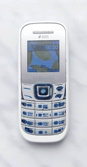 telefon arxaliqlari: Samsung GT-E1210, rəng - Ağ, Düyməli, İki sim kartlı