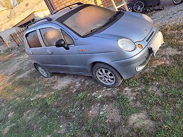 скотч с надписью: Daewoo Matiz: 2010 г., Механика, Бензин, Хэтчбэк — 1
