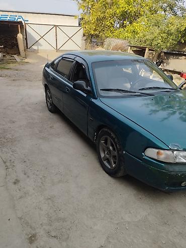 мото номер: Mazda 626: 1991 г., Бензин, Хэтчбэк — 3