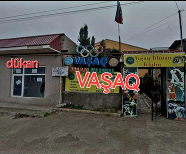 Binalar: Binə qəsəbəsində yerləşən “Vasaq” İdman Klubu və yanında ayrıca — 2
