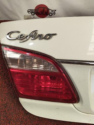 Фонарь крышки багажника левый для NISSAN Cefiro A33 (второе