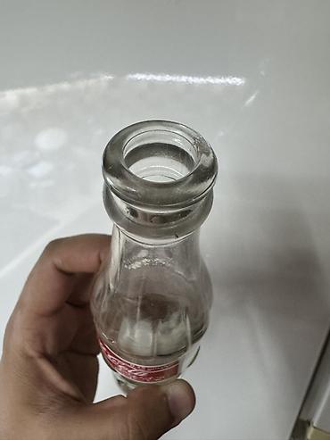gürcü xengeli: Məhsul: Şüşə Coca‑Cola butulkası Təsvir: - Həcm: 0.25 L (etiketdə — 3